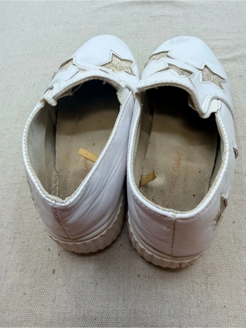 ' White Slip-On Sneakers with Gold Star Accents